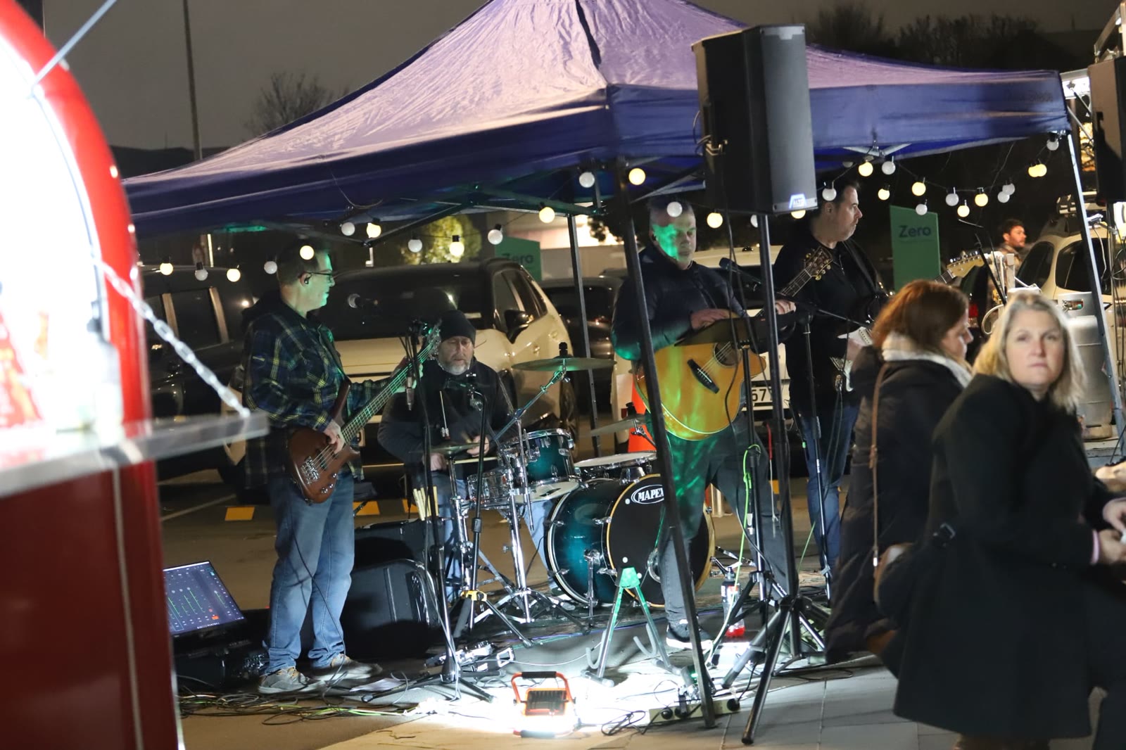 Zero Hour on stage with the night market crowd